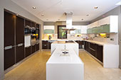 Kitchen with white bench tops