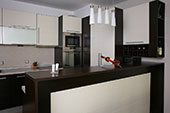 Brown dark coloured kitchen